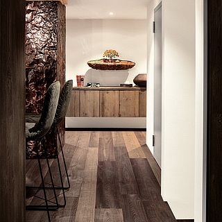 Minimalist hallway with elegant wooden flooring, floating sideboard and decorative bonsai sculpture - interior design photography by Bluesun.